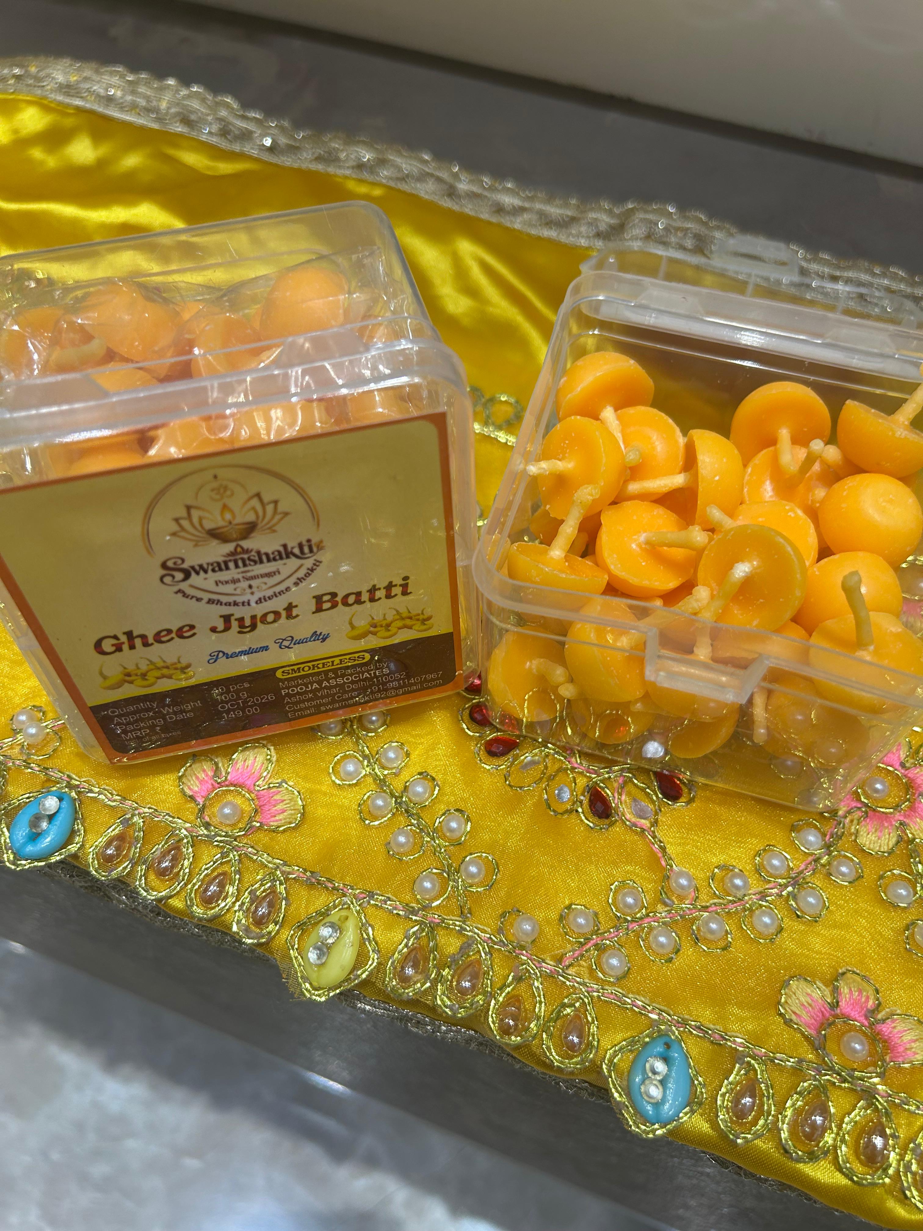 Scented Batti burning with brass diya and flowers